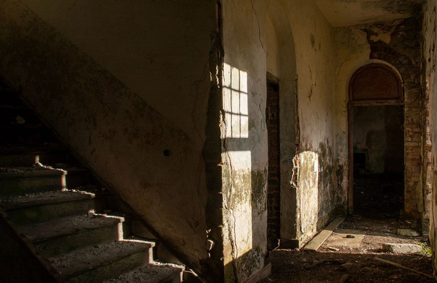 Light shines through door and window at workhouse