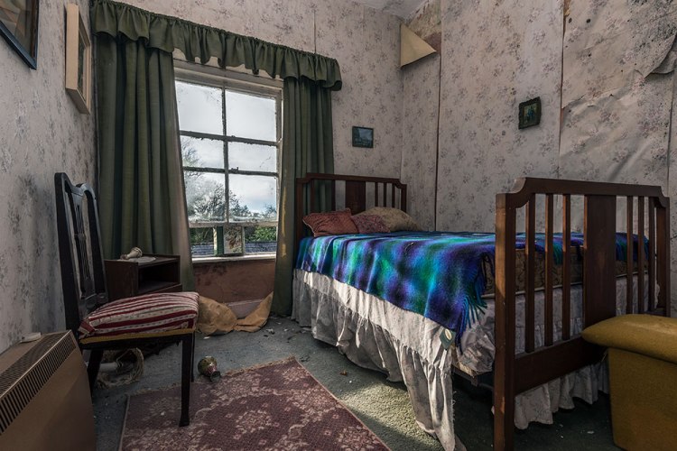 Bedroom with woven rug from An Essence of Presence exhibition