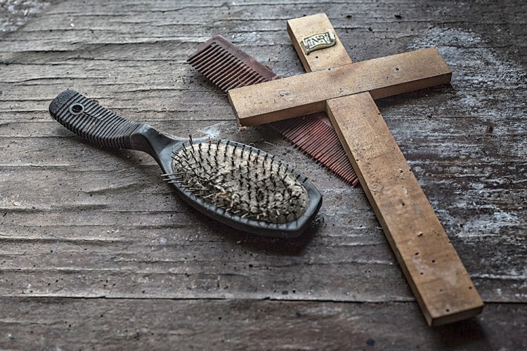 Hairbrush, comb and cross from An Essence of Presence exhibition